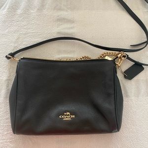 Coach crossbody black leather and gold bag.